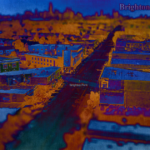 Aerial-isometric view of Brighton Park area, facing downtown Chicago in the distance. The picture has been difference filtered to appear heavy with dark blues and oranges, and is tilt-shift blurred to focus on the Brighton Park area.